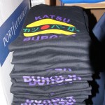 A stack of Katsu Burger t-shirts