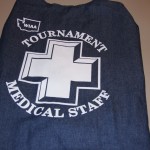 A blue fabric bag with a white medical cross and "WIAA Tournament Medical Staff" printed on it—perfect for carrying Medical Vests or essentials at your next WIAA Tournament. Rain City West
