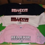 Pink, white, and black softball team shirts