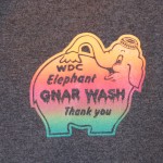 Logo featuring a pink and orange elephant spraying water on its back, with the text "WDC Elephant GNAR WASH Thank you" on a gray background—perfect for jerseys or t-shirts using high-quality screen printing. Rain City West