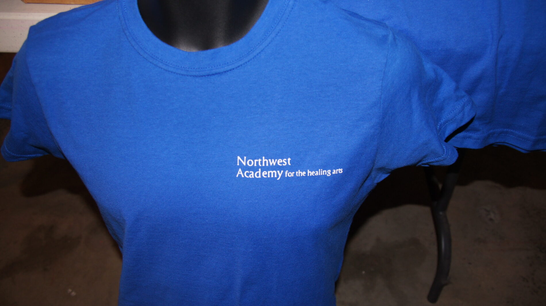 Left chest screen print for NW Academy for the healing arts.