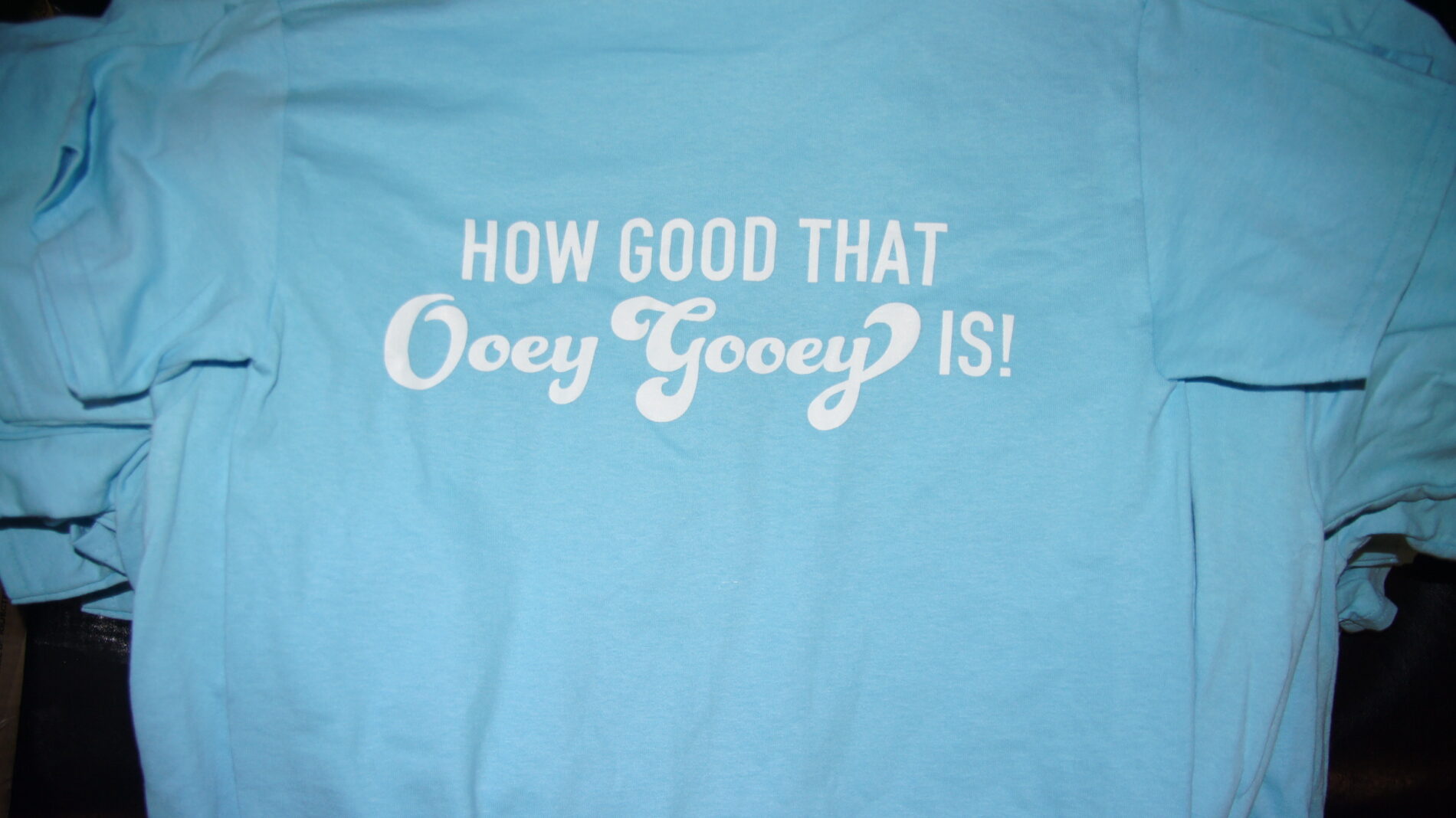 Back of t-shirt that says Ooey Gooey