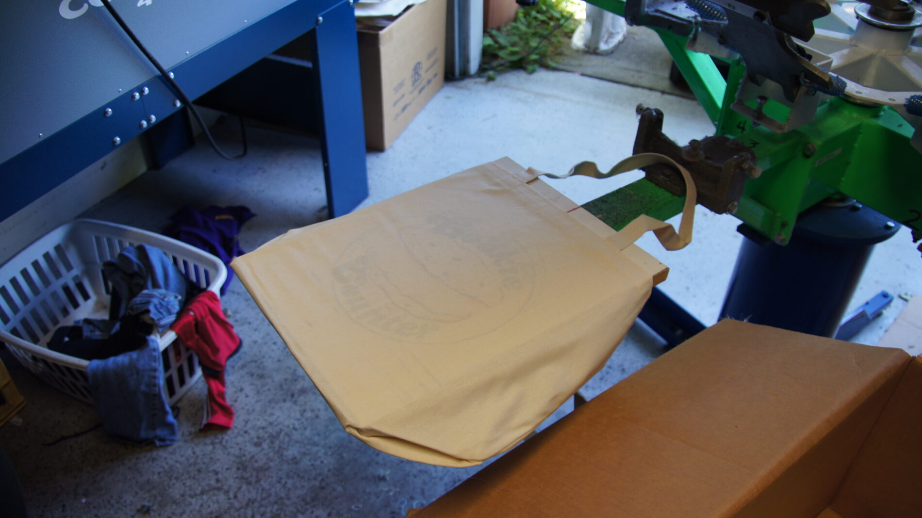 Tote bag on screen printing press