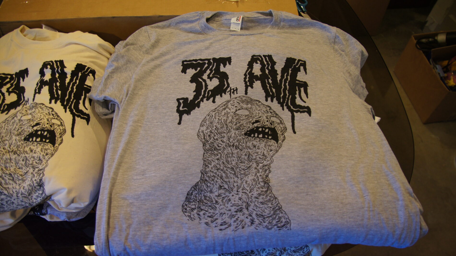 1-color screen prints on grey t-shirts.