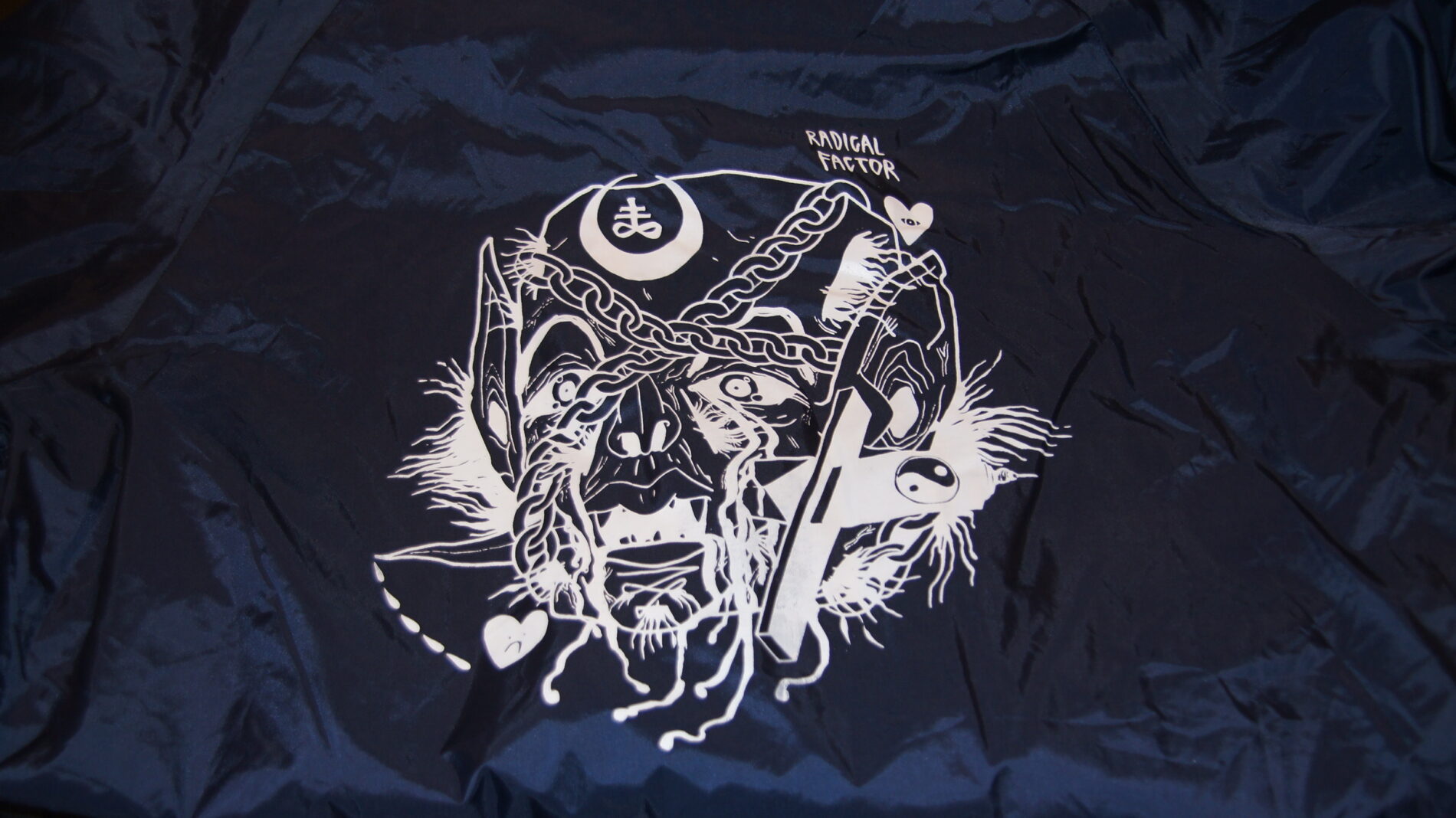 1-color screen print on the back of the coach jacket.