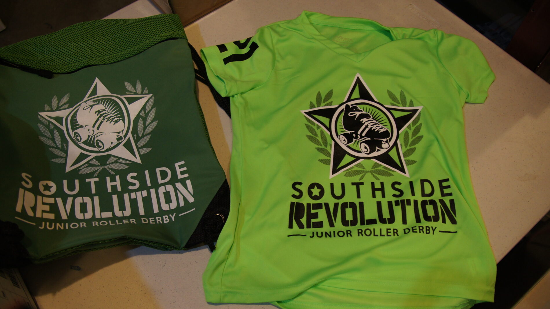 Screen printed swag for junior roller derby team.