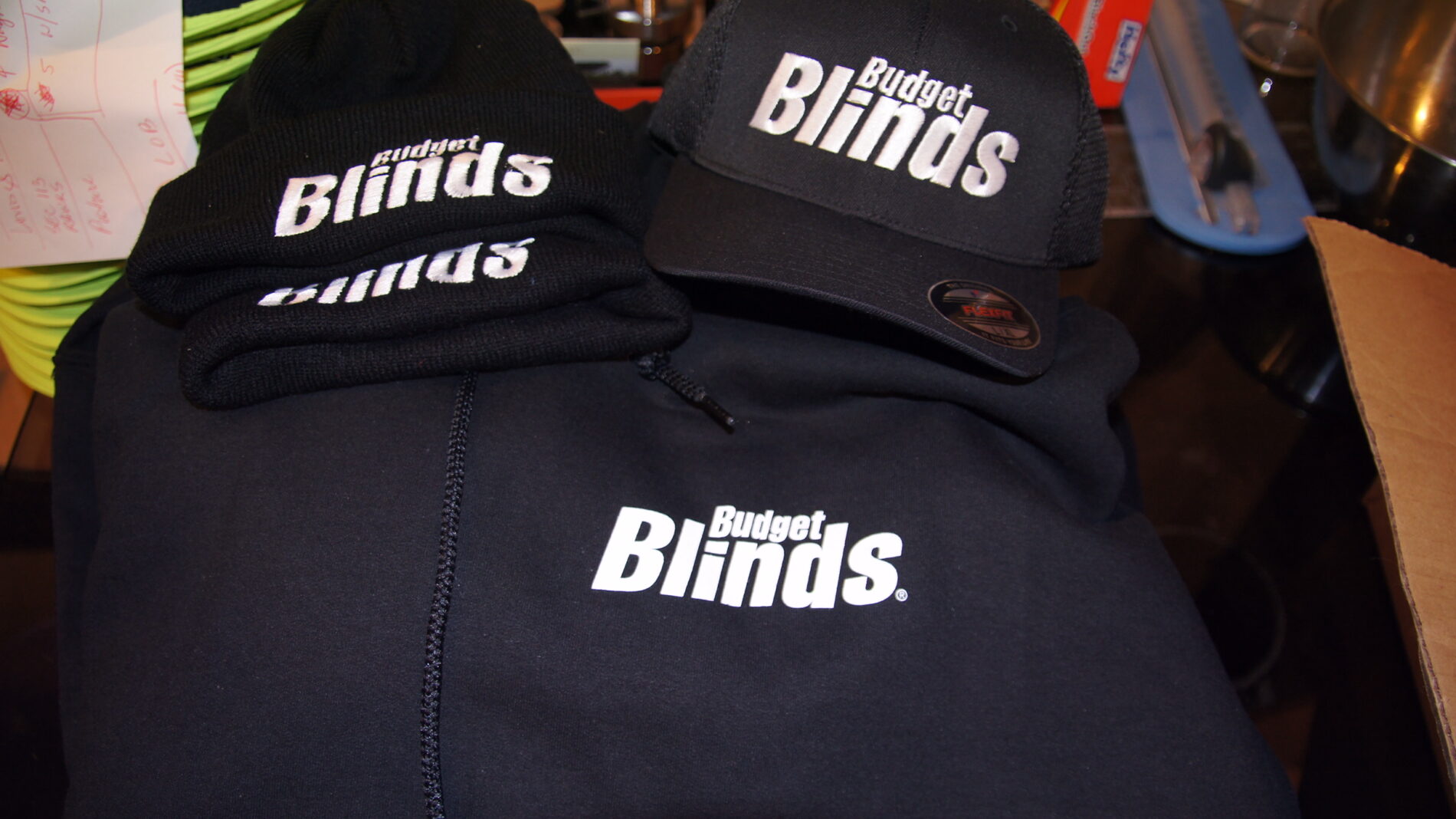 Sweatshirts and hats for West Seattle Budget Blinds.