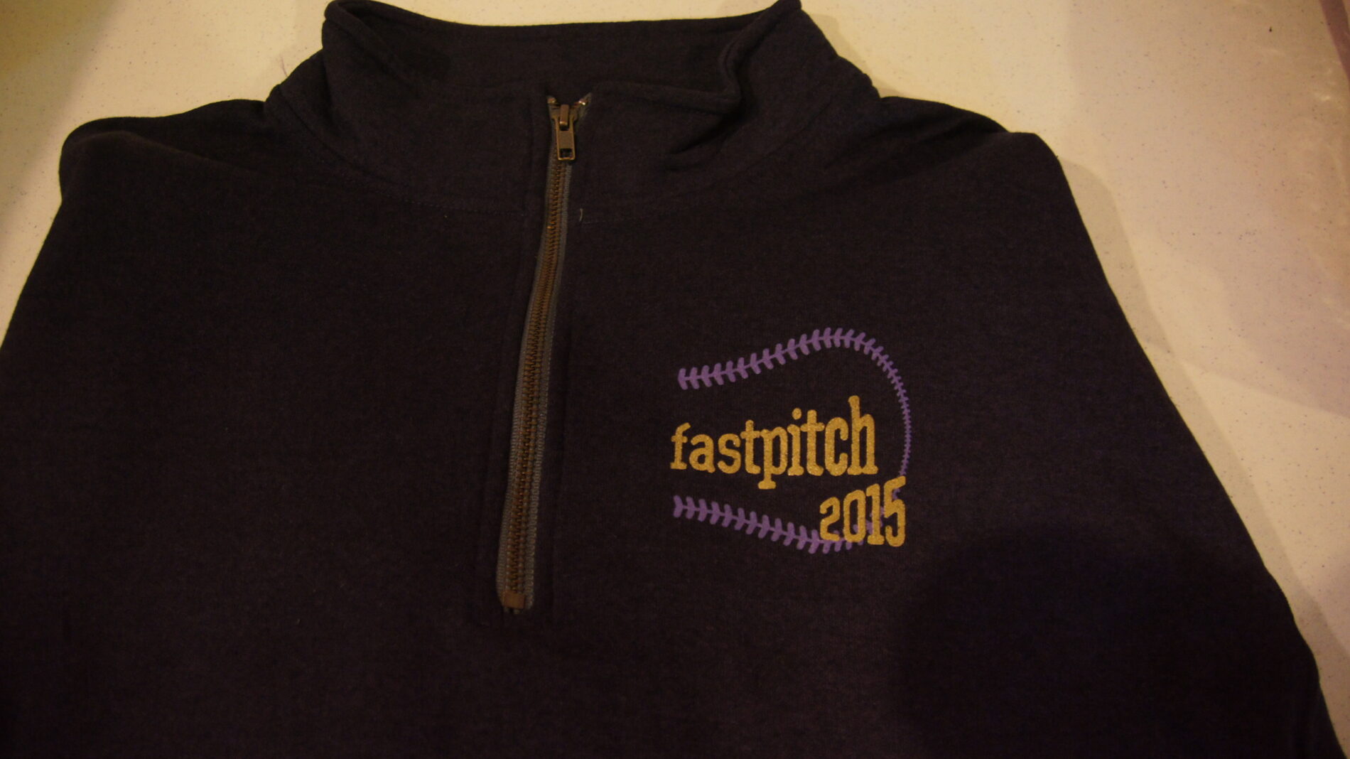 2-color screen printed 3/4 zip Fastpitch fleece