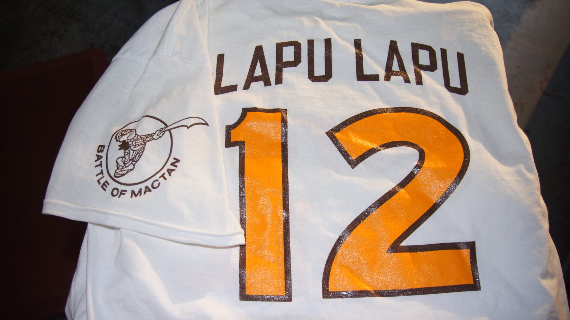 Team name and numbers on the back.