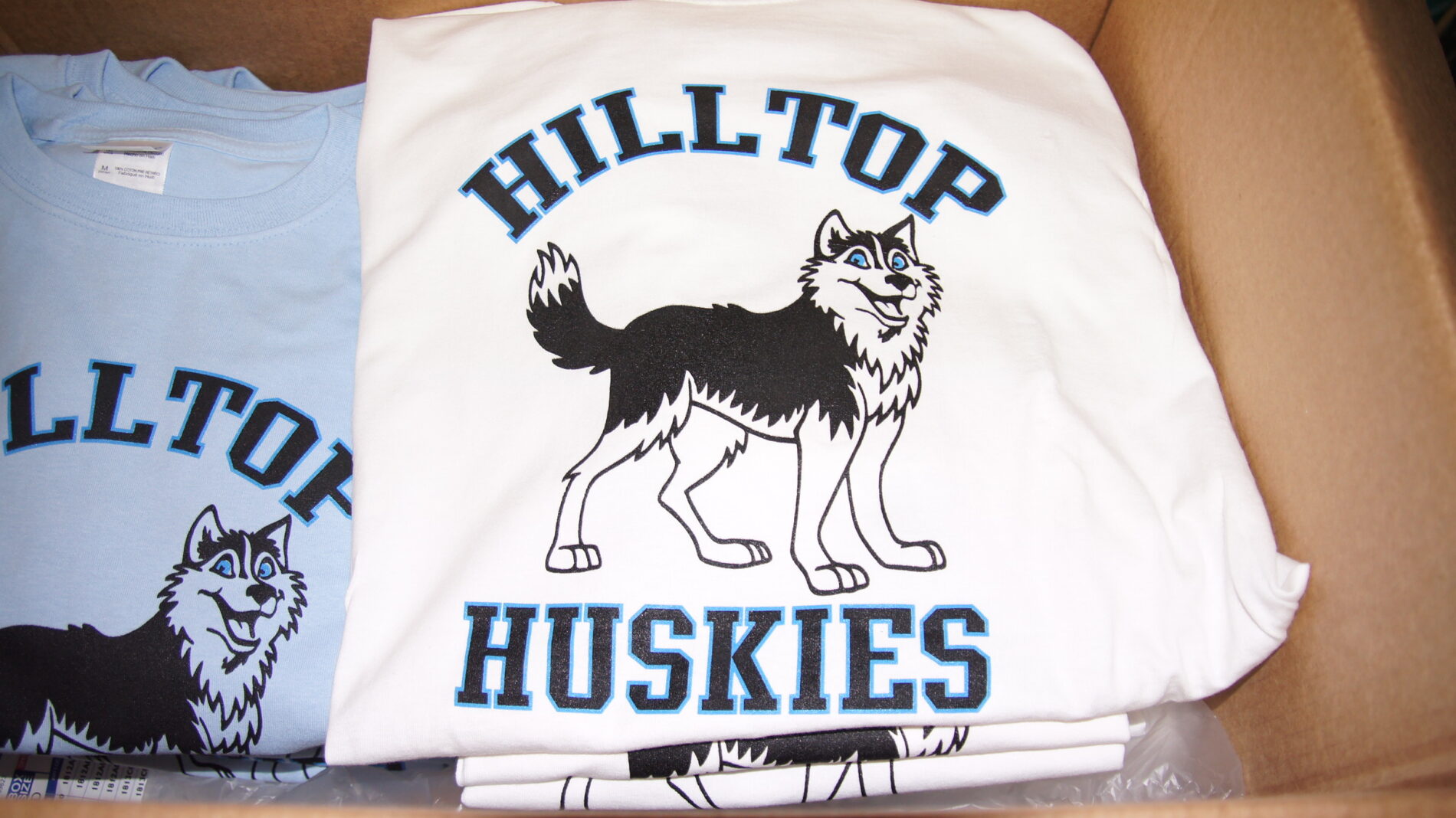 2-color screen printed t-shirt for Hilltop Huskies with personalized names on the back.