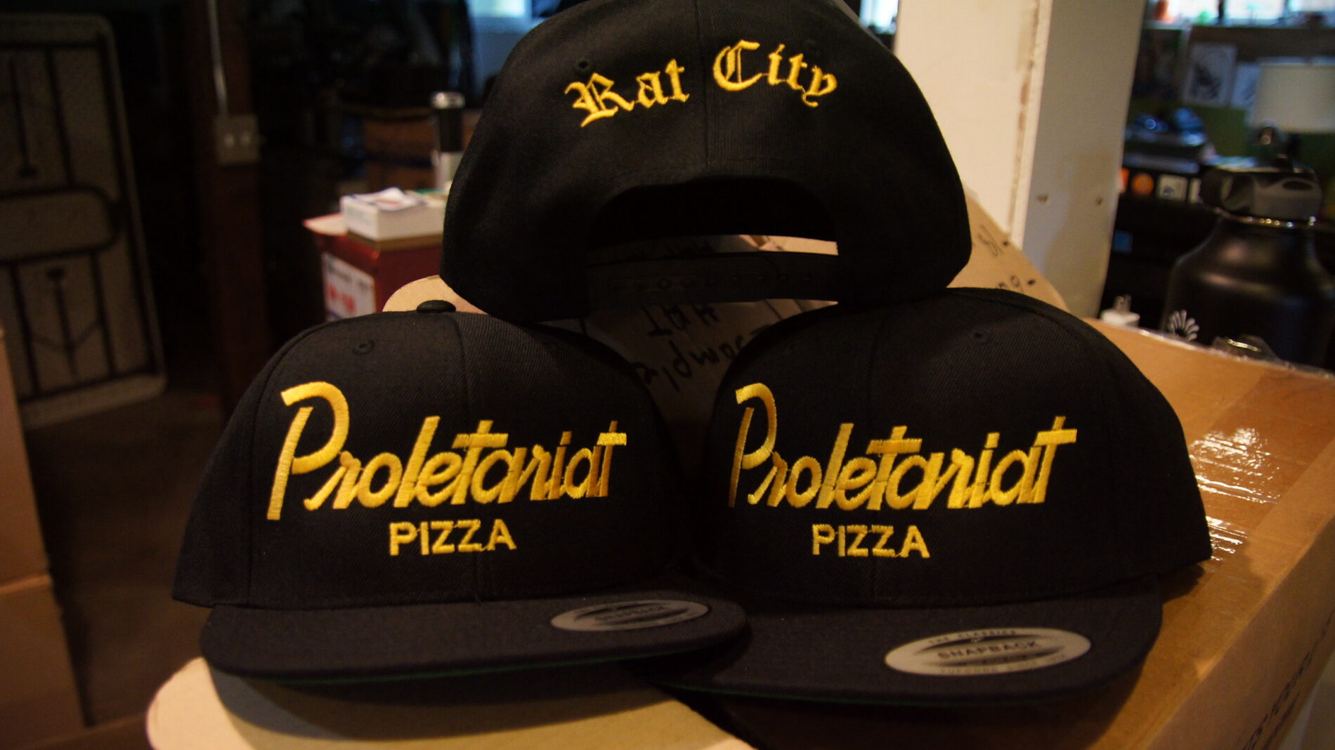 Embroidered hats for White Center's local pizza parlor, Proletariat Pizza.