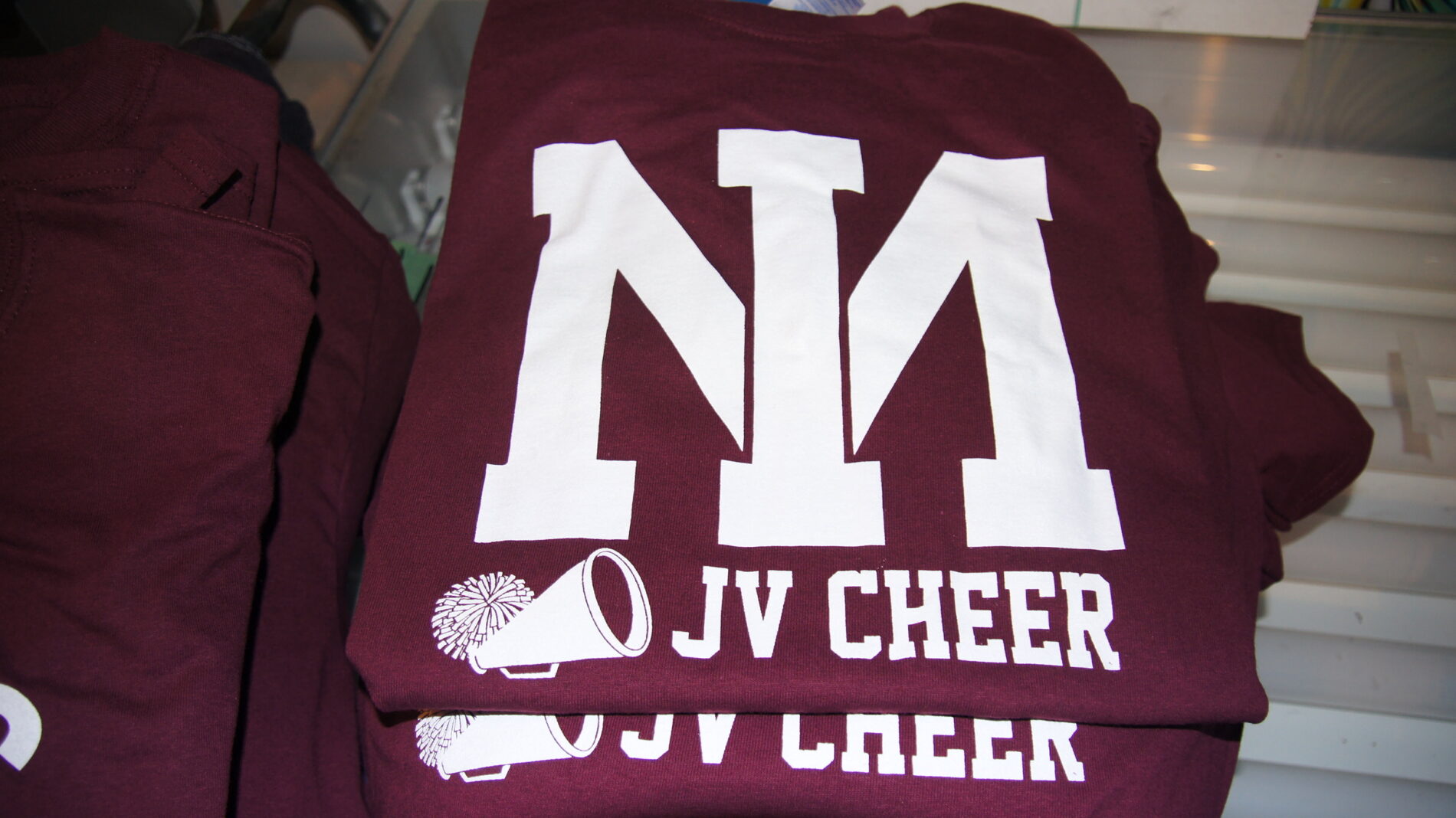 And 1-color screen printed maroon t-shirts for the JV squad.