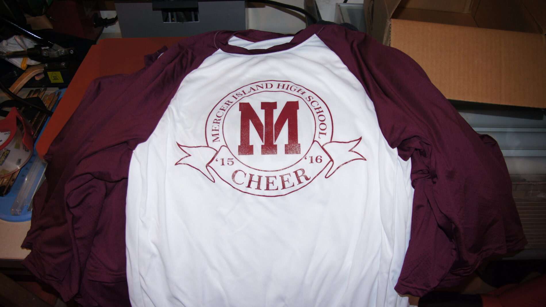 1-color screen printed 3/4 raglan baseball t-shirt for Mercer Island Cheer. 