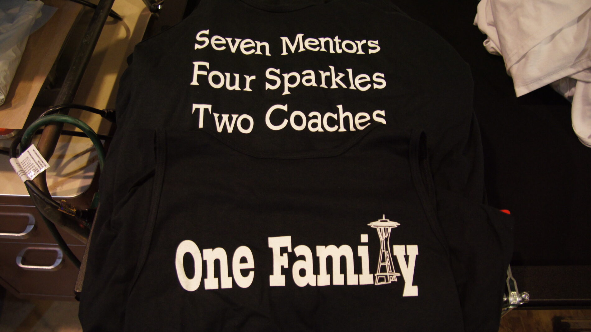 Screen printed tanks for One Family.