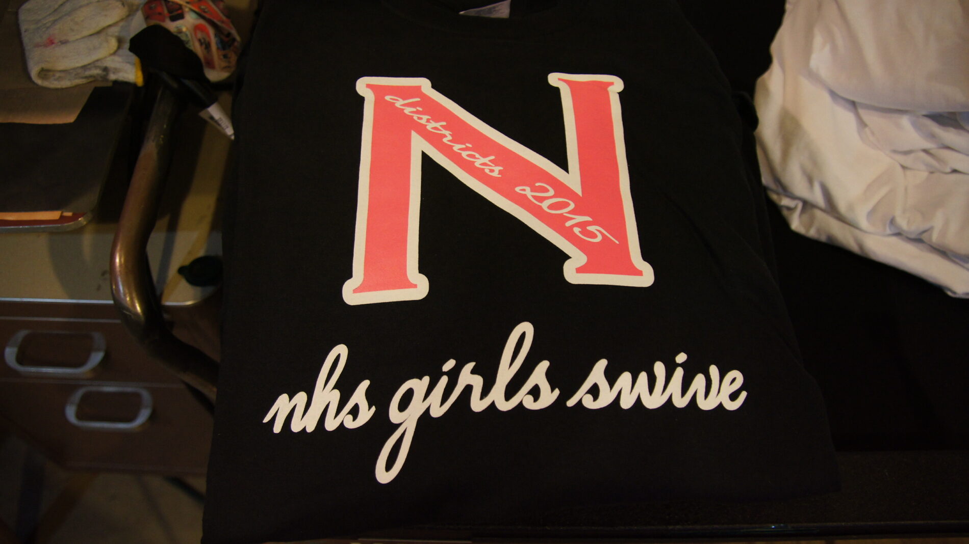 2-color front and 1-color back screen printed long sleeved t-shirts for Newport High School SWIVE team.