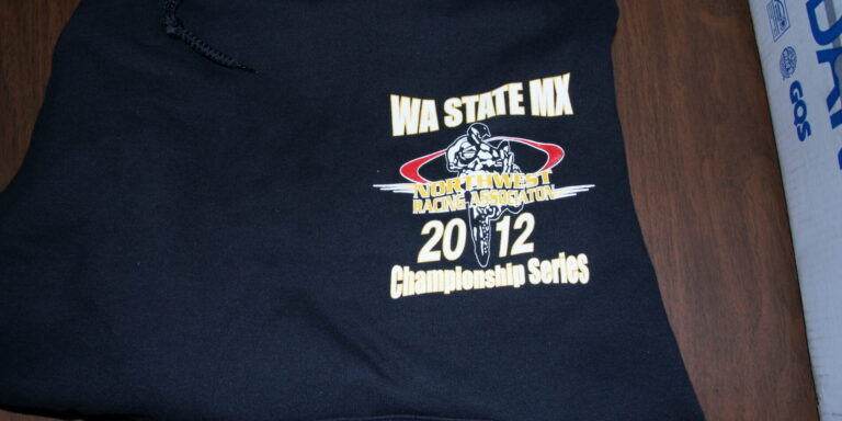 Black Motorcross sweatshirt displaying "WA STATE MX Northwest Racing Association 2012 Championship Series" with a motocross graphic on the front. Perfect for fans of Motorcross sweatshirts and the Hyper X racing spirit. Rain City West