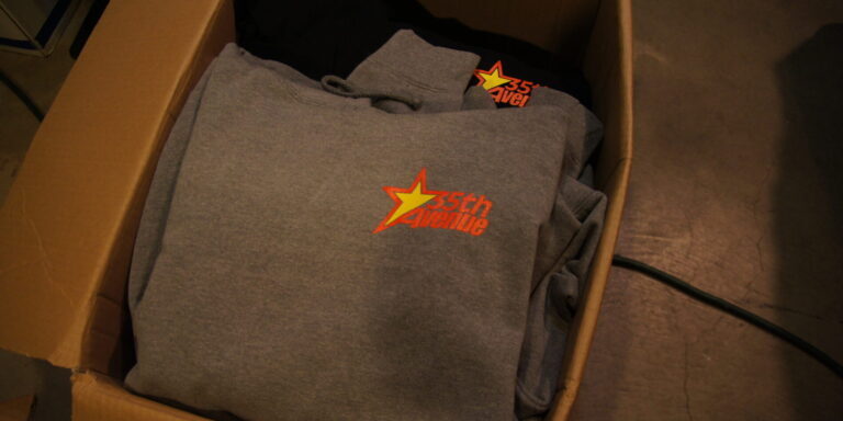 2-color left chest screen printed on a hooded sweatshirt for 35th Avenue. 