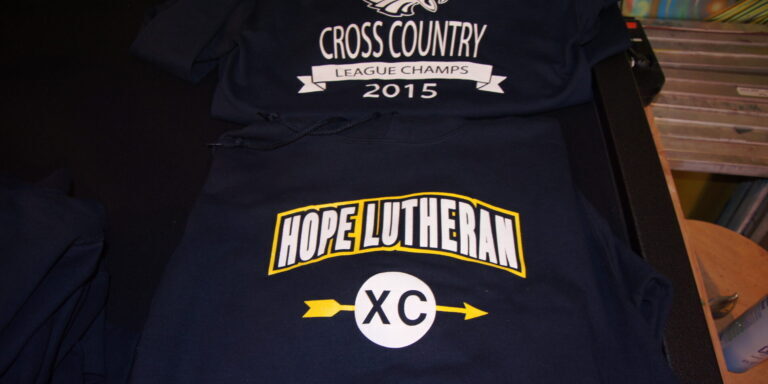 2-color front and 1-color back screen printed hooded sweatshirts for Hope Lutheran School.
